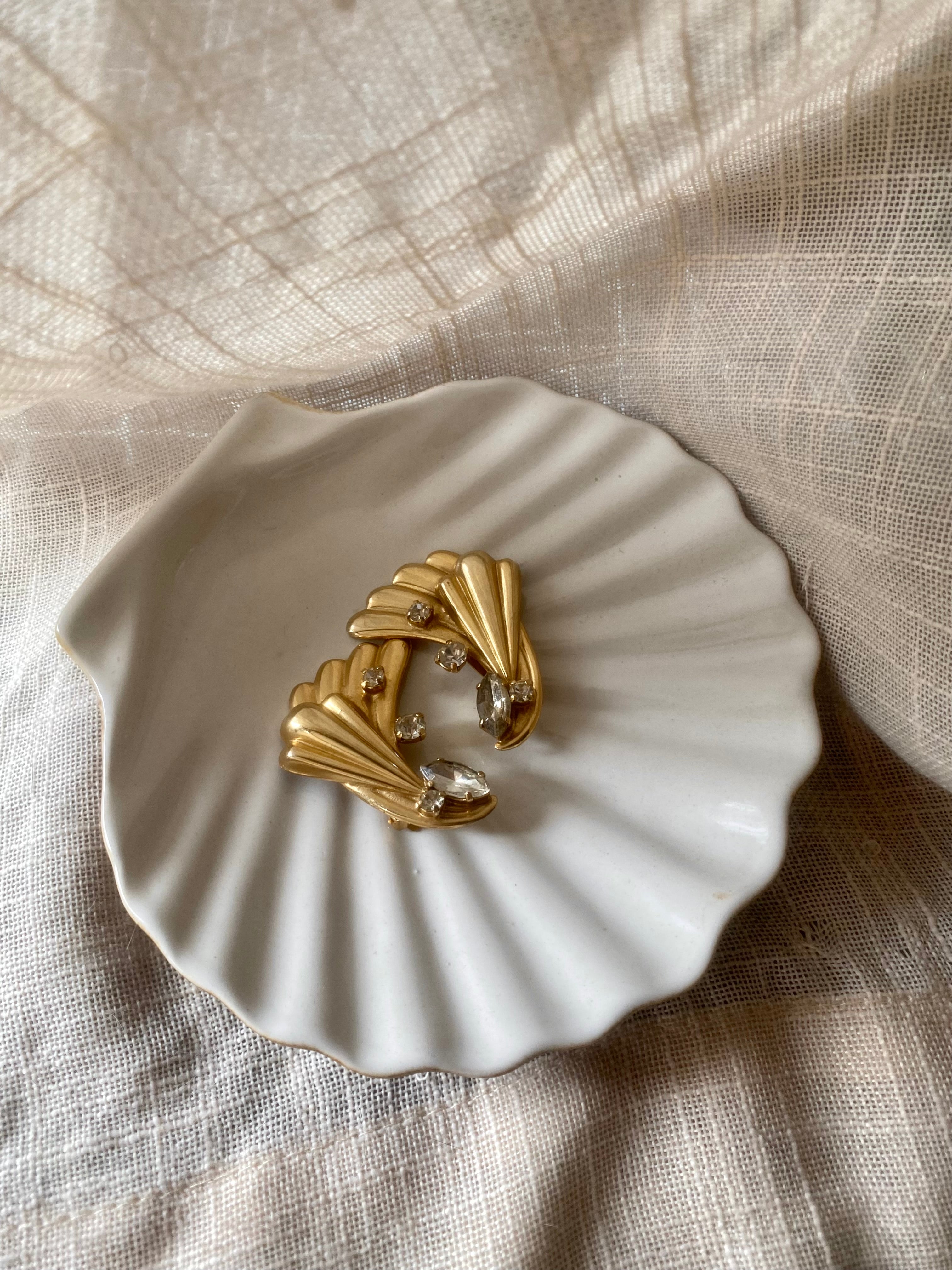 Ali orecchini con punto luce