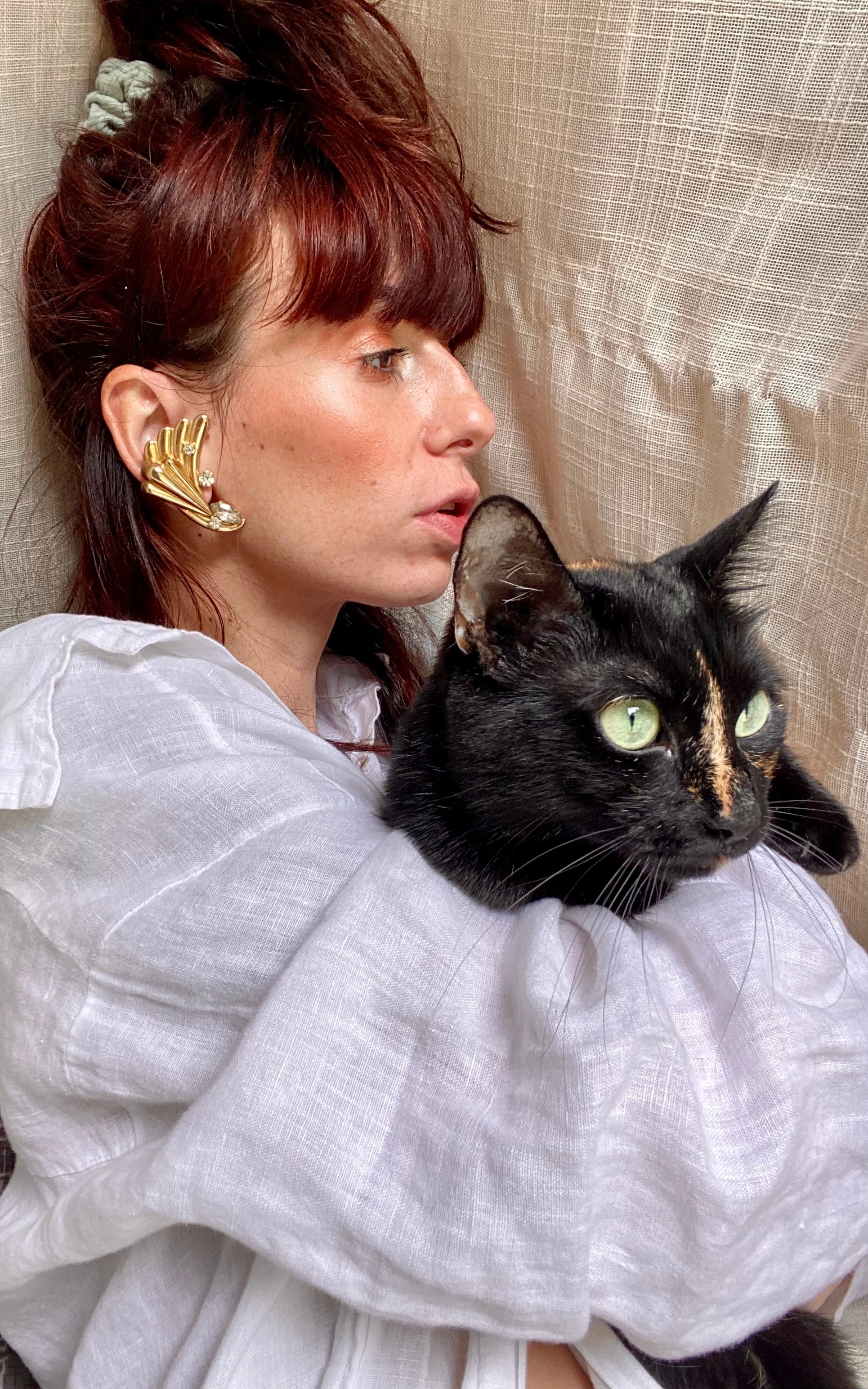 Ali orecchini con punto luce